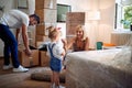 Happy family moving into a new house and unpacking Royalty Free Stock Photo