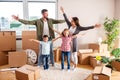 Happy family moving in their new home and having a playtime with their children Royalty Free Stock Photo