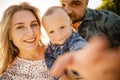 Happy family in nature. Mother, father and son in nature.