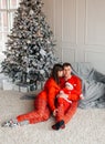 Happy family near the Christmas tree for the New Year Royalty Free Stock Photo