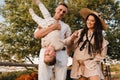 Happy family near horses at a farmer& x27;s ranch at sunset Royalty Free Stock Photo