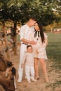 Happy family near horses at a farmer& x27;s ranch at sunset Royalty Free Stock Photo