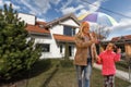 Happy family near new house. Real estate concept. Royalty Free Stock Photo