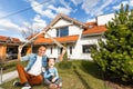Happy family near new house. Real estate concept. Royalty Free Stock Photo