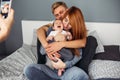 Happy family with newborn baby on the bed Royalty Free Stock Photo