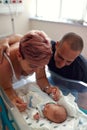 Family with newborn baby in postnatal hospital