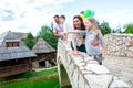 Happy family observing the surroundings from the side of the bridge Royalty Free Stock Photo