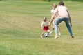 happy family with one child playing with soccer ball Royalty Free Stock Photo