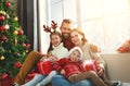 Happy family   open presents on Christmas morning Royalty Free Stock Photo