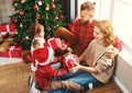 Happy family   open presents on Christmas morning Royalty Free Stock Photo