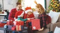 Happy family open presents on Christmas morning Royalty Free Stock Photo