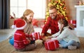 Happy family   open presents on Christmas morning Royalty Free Stock Photo