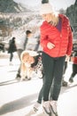 Happy family outdoor ice skating at rink. Winter activities Royalty Free Stock Photo