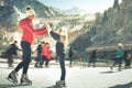 Happy family outdoor ice skating at rink. Winter activities Royalty Free Stock Photo