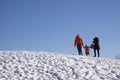 Happy family in outdoors  - Father, mother and child are having fun on a snowy winter walk in nature Royalty Free Stock Photo