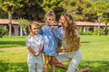 Happy family outdoors on the grass in a park, smiling faces, having fun Portrait of a disgruntled girl sitting at a cafe Royalty Free Stock Photo