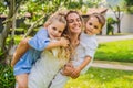 Happy family outdoors on the grass in a park, smiling faces, having fun Portrait of a disgruntled girl sitting at a cafe Royalty Free Stock Photo