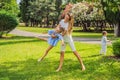 Happy family outdoors on the grass in a park, smiling faces, having fun Portrait of a disgruntled girl sitting at a cafe Royalty Free Stock Photo