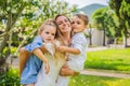 Happy family outdoors on the grass in a park, smiling faces, having fun Portrait of a disgruntled girl sitting at a cafe Royalty Free Stock Photo