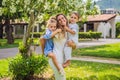 Happy family outdoors on the grass in a park, smiling faces, having fun Portrait of a disgruntled girl sitting at a cafe Royalty Free Stock Photo