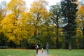 Happy family outdoors. Mother, father and baby on autumn walk in the park Royalty Free Stock Photo