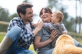 happy family outdoors with their child and dog Royalty Free Stock Photo