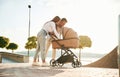 Happy family outdoors. A young couple with a baby pram is walking together Royalty Free Stock Photo