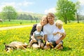 Happy Family Outside in Dandelions Royalty Free Stock Photo