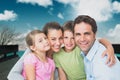 Happy family outside of home Royalty Free Stock Photo