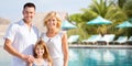 Happy family over hotel resort swimming pool Royalty Free Stock Photo