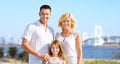 Happy family over rainbow bridge background Royalty Free Stock Photo