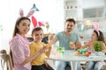 Happy family painting Easter eggs in kitchen Royalty Free Stock Photo