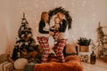 Happy family in pajamas with childparents play with child jumping on bed in bedroom Royalty Free Stock Photo