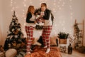 Happy family in pajamas with childparents play with child jumping on bed in bedroom Royalty Free Stock Photo