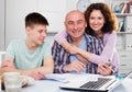 Happy family with papers Royalty Free Stock Photo