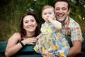 Happy family - parents and baby daughter Royalty Free Stock Photo