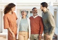 Happy family, parents and couple at a new home due to real estate laughing together and bonding as love or care. Outdoor Royalty Free Stock Photo