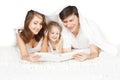 Happy family parents reading book with child Royalty Free Stock Photo