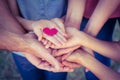 Happy family in the park holding a heart Royalty Free Stock Photo