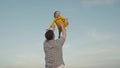 happy family park. little child girl flies against sky. father plays kid daughter baby superhero outdoor. happy