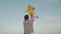 happy family park. little child girl flies against sky. father plays kid daughter baby superhero outdoor. happy