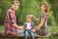 Happy family in a park Royalty Free Stock Photo