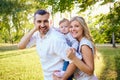 Happy family in a park in summer autumn.