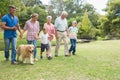 Happy family in the park with their dog Royalty Free Stock Photo