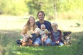 Happy Family of 5 People and Dog in Sunny Garden Royalty Free Stock Photo