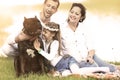 happy family with pet dog at picnic in a Sunny summer day. pregn Royalty Free Stock Photo