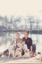 Happy family with Pets near the lake Royalty Free Stock Photo