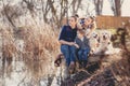 Happy family with Pets near the lake Royalty Free Stock Photo