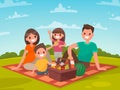 Happy family on a picnic. Dad, mom, son and daughter are resting Royalty Free Stock Photo