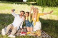 Happy Family On Picnic Making Selfie Spending Day Together Outdoor